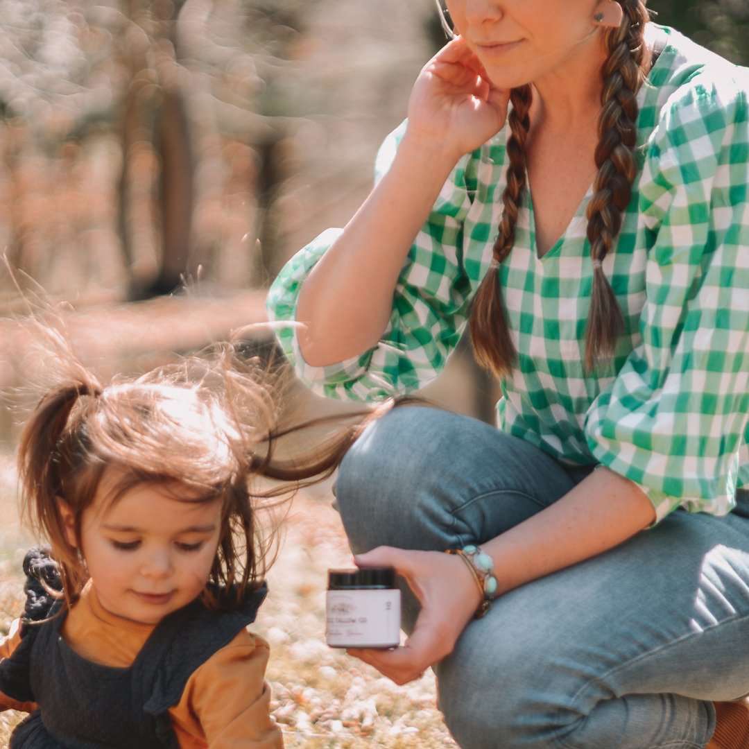 Picture of mother and daughter holding Little Tallow Co Traditional Balm